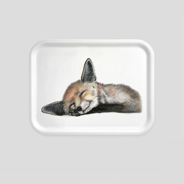 sleeping fox on a small wooden tray
